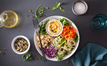 veggie couscous lunch bowl with spiralazed carrots and zucchini, hummus and red cabbage